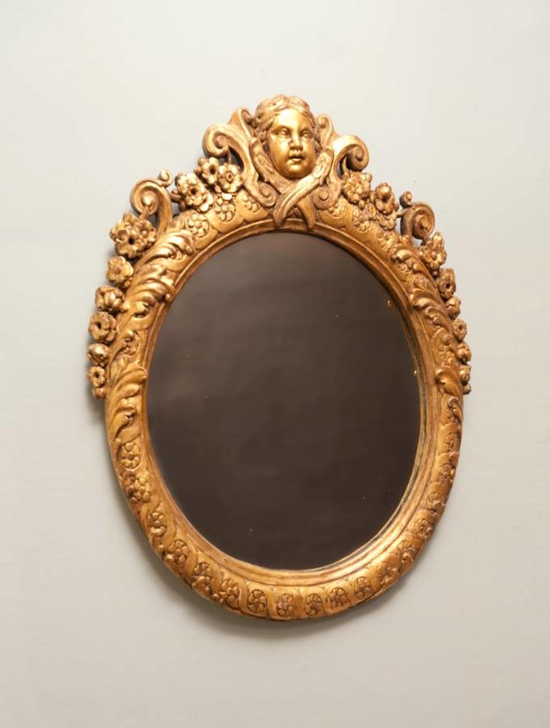 Louis XIV style carved gilt wood mirror