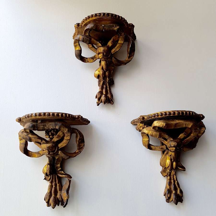 Three gilt wood and composition wall brackets