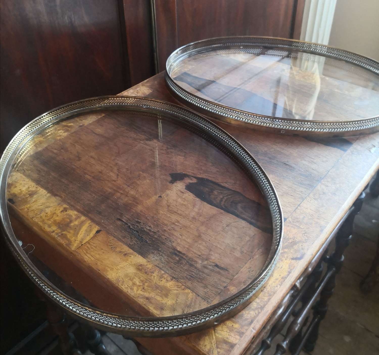 A pair of gilt metal oval trays