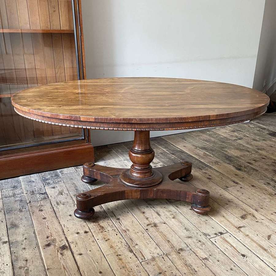 A rosewood centre table by Holland & Sons