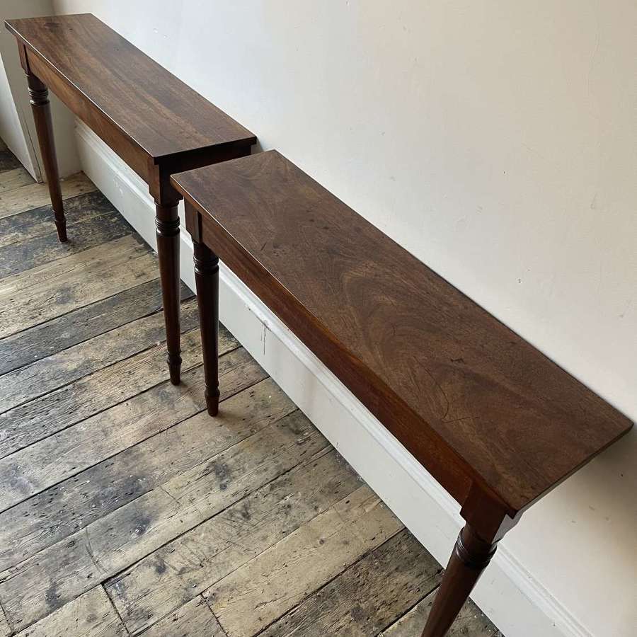 A pair of 19th century console tables