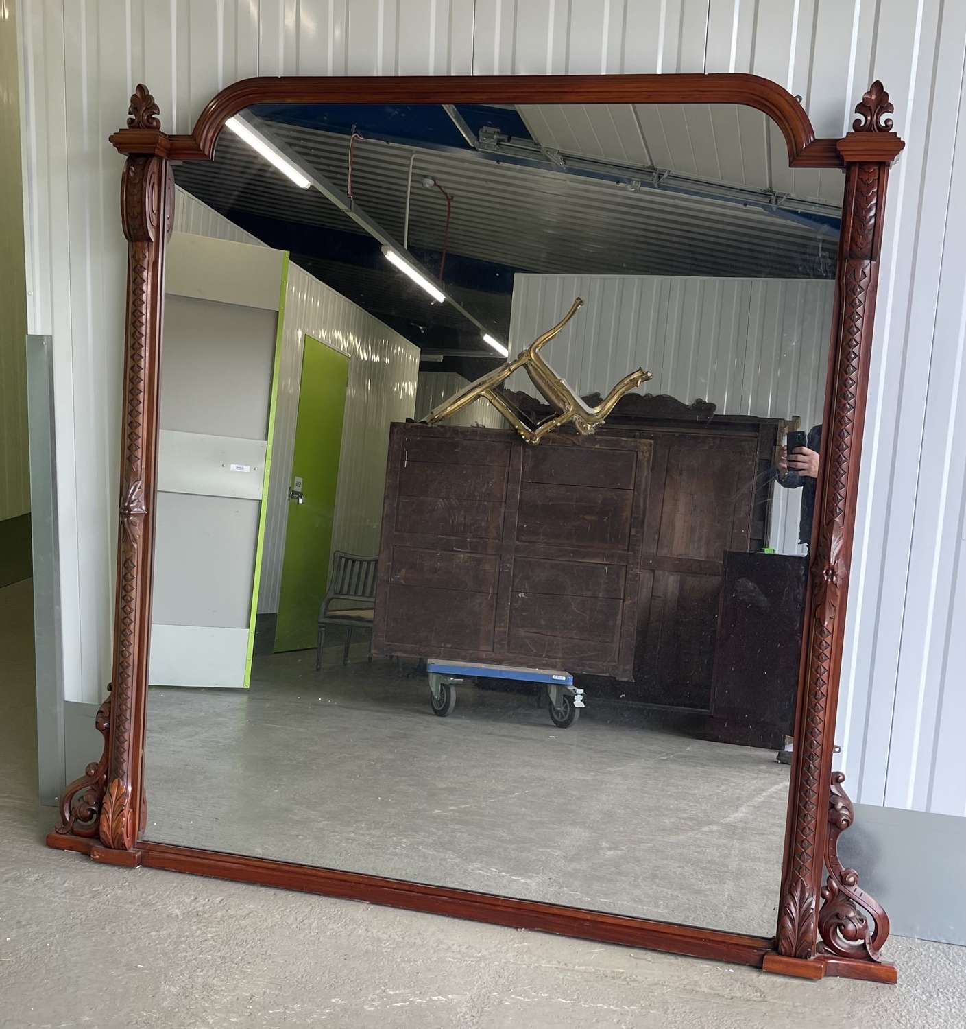A large mahogany over mantle mirror