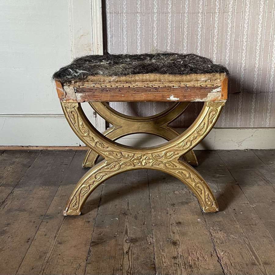 A 19th century gilt wood stool by Holland and Sons