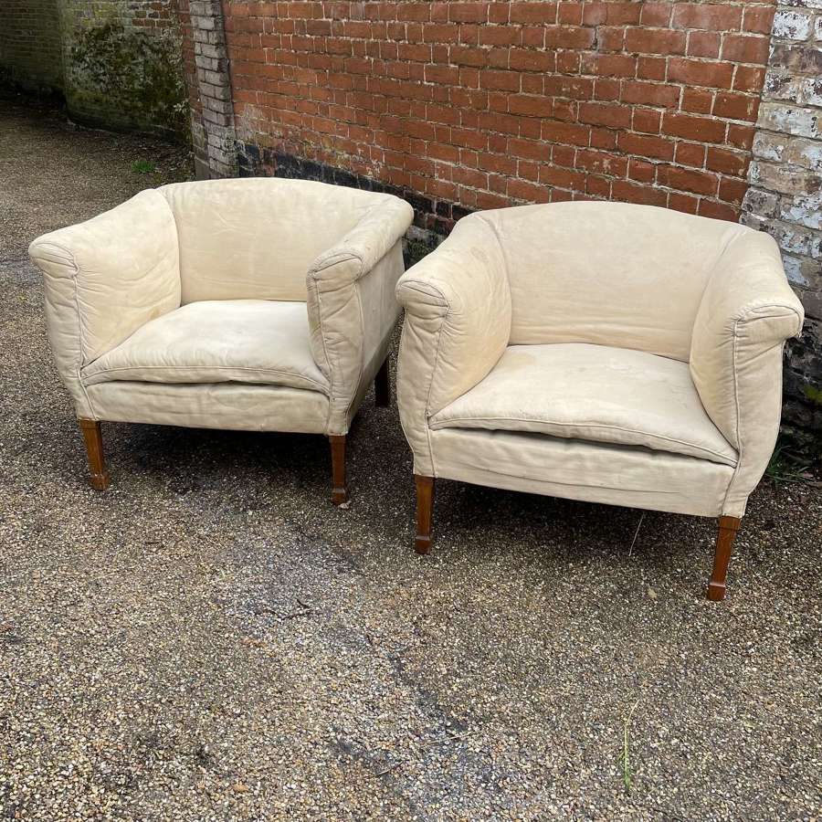 A pair of club chairs