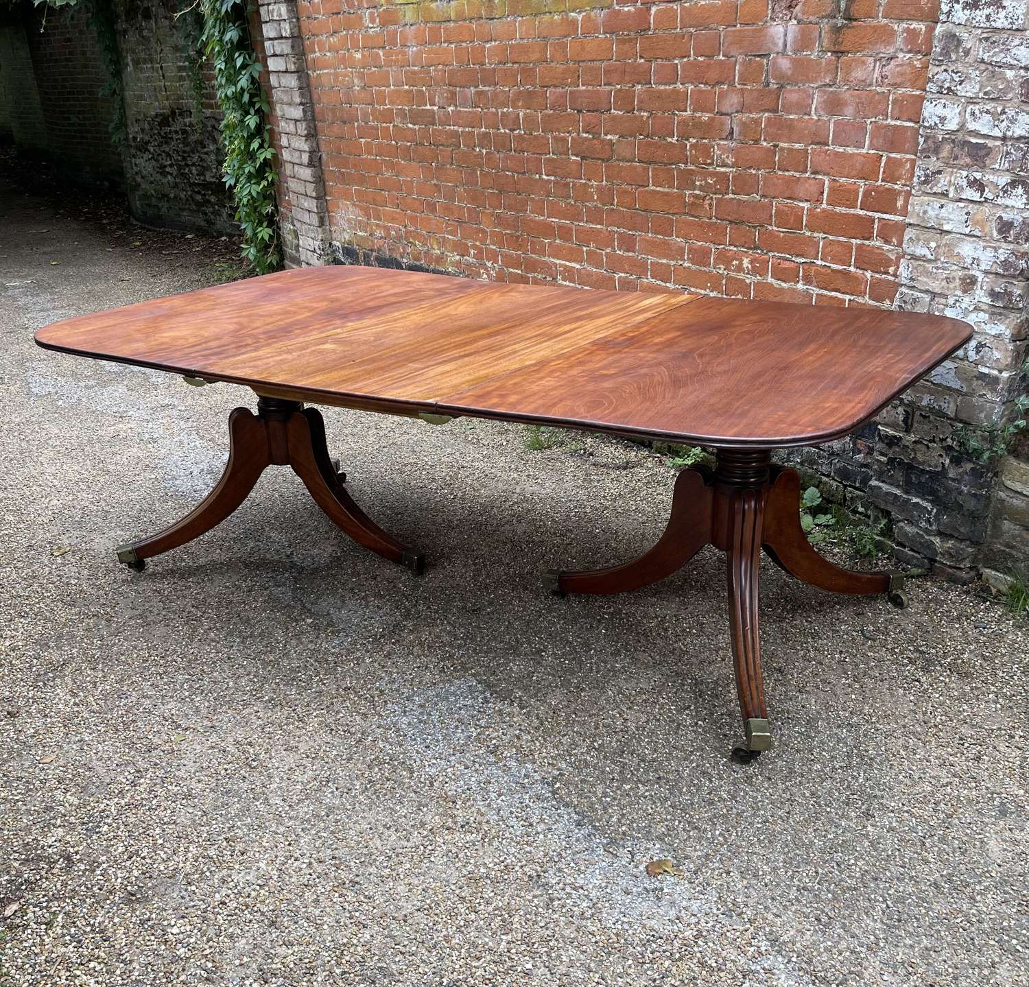 A George III twin pedestal dining table