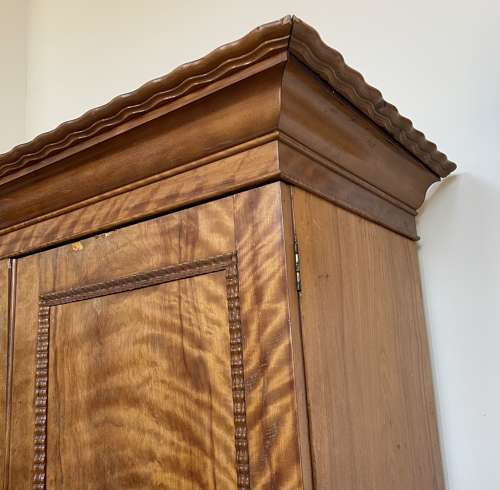 A 19th century satin birch wardrobe