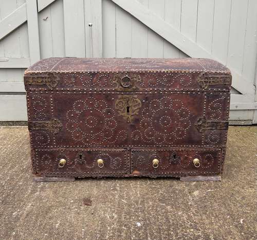 A Queen Anne studded leather trunk