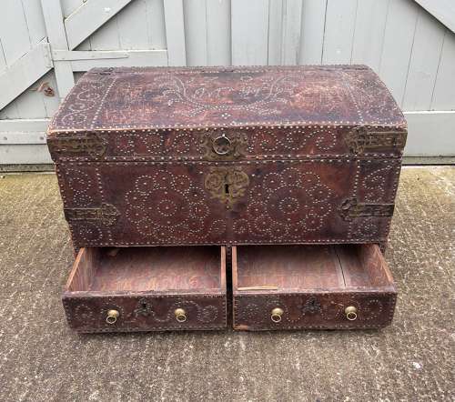 A Queen Anne studded leather trunk