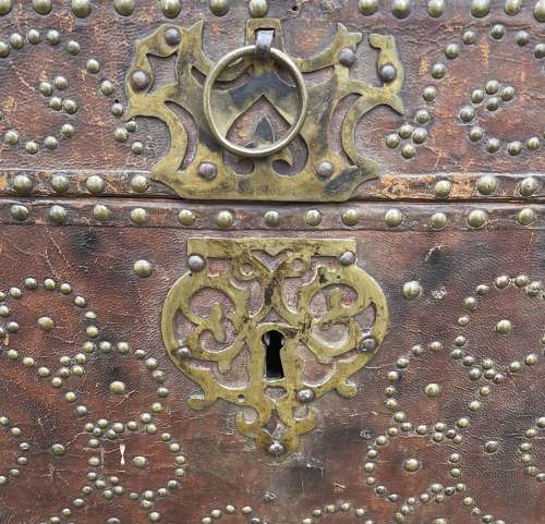 A Queen Anne studded leather trunk