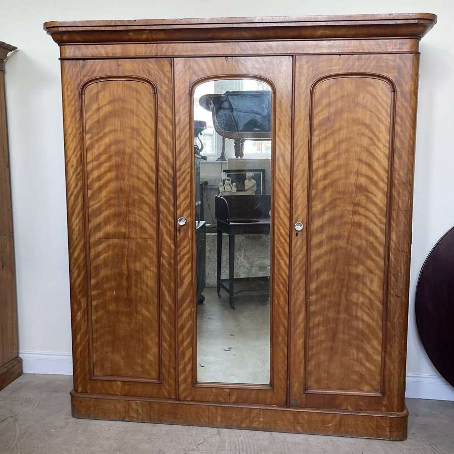 A 19th century satin birch wardrobe