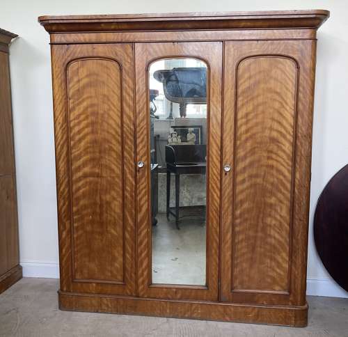A 19th century satin birch wardrobe