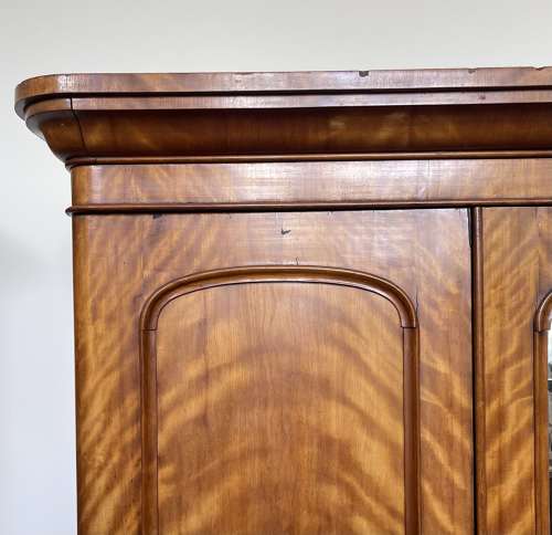 A 19th century satin birch wardrobe
