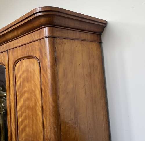 A 19th century satin birch wardrobe