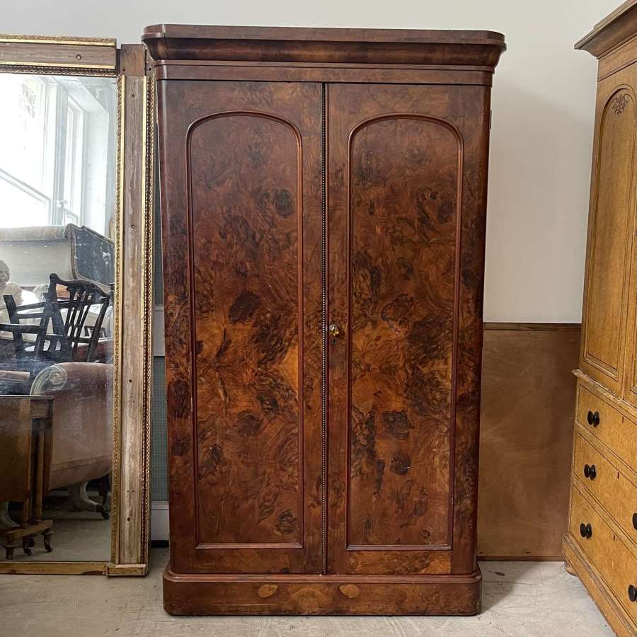 A 19th century simulated bur walnut wardrobe