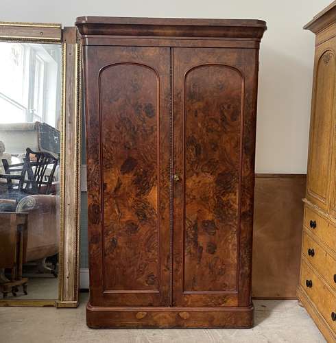 A 19th century simulated bur walnut wardrobe