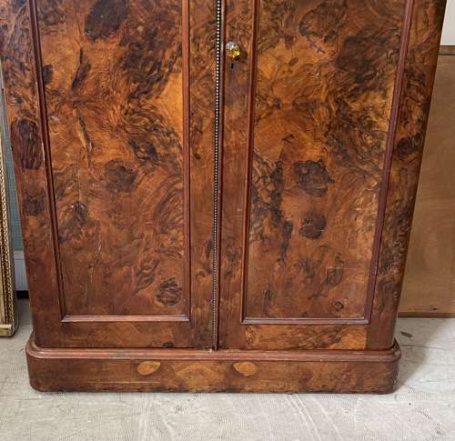 A 19th century simulated bur walnut wardrobe