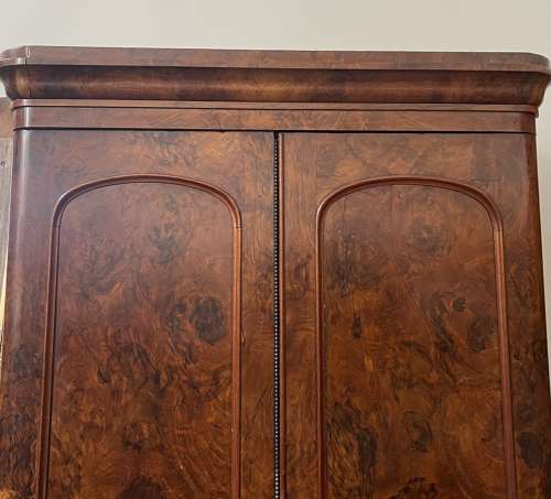 A 19th century simulated bur walnut wardrobe