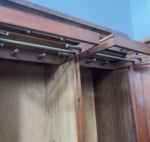 A 19th century simulated bur walnut wardrobe