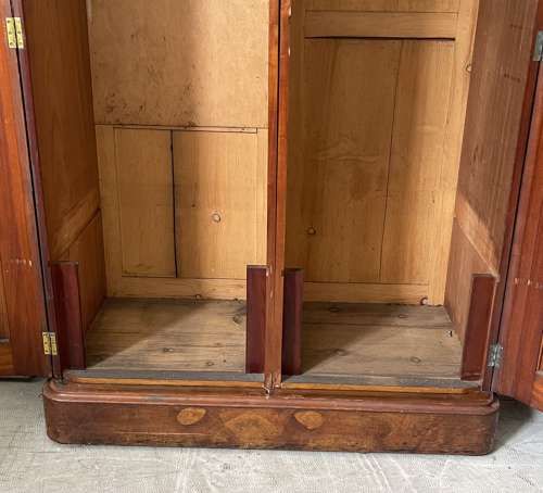 A 19th century simulated bur walnut wardrobe