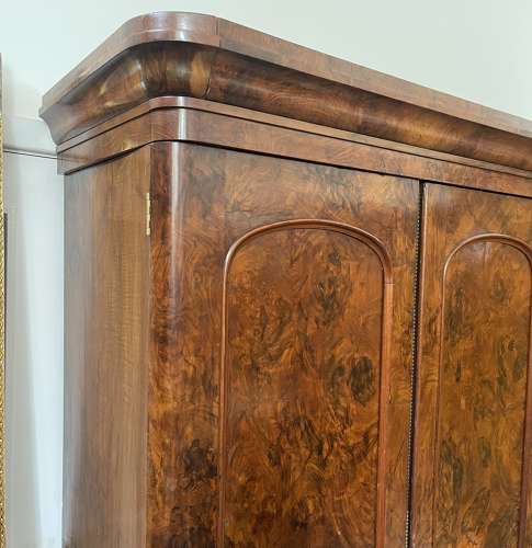 A 19th century simulated bur walnut wardrobe