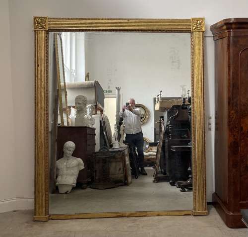 A very large Regency overmantle mirror