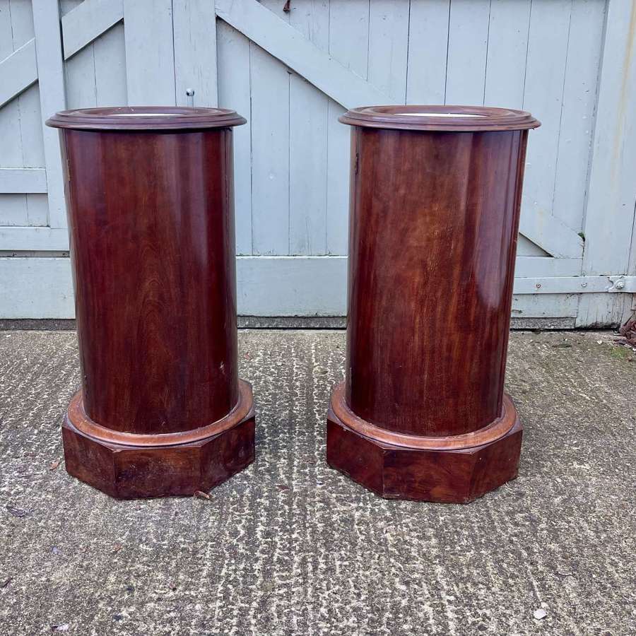 A pair of 19th century cylindrical bedside cupboards