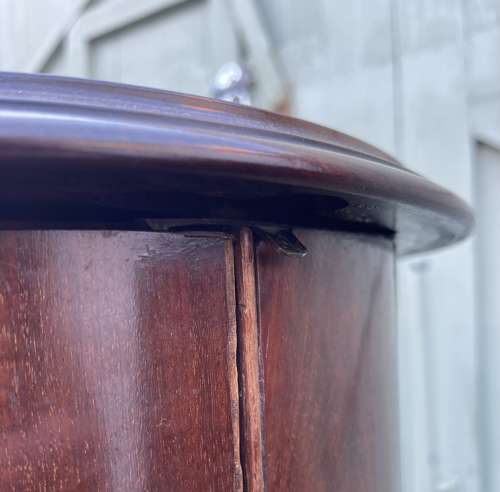 A pair of 19th century cylindrical bedside cupboards