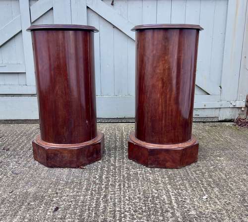 A pair of 19th century cylindrical bedside cupboards