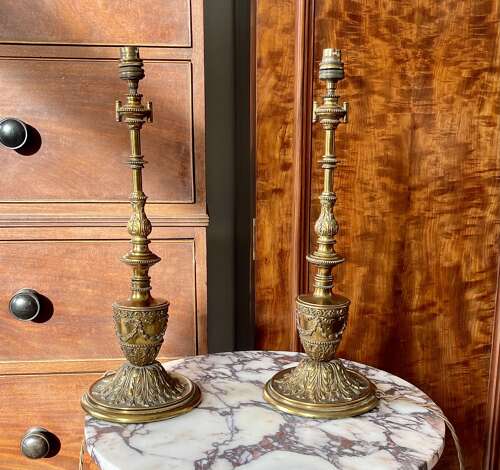 A pair of gilt metal lamps