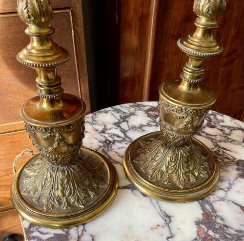 A pair of gilt metal lamps