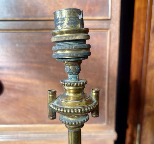 A pair of gilt metal lamps