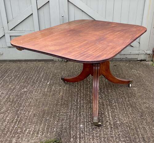 A 19th century twin pillar dining table