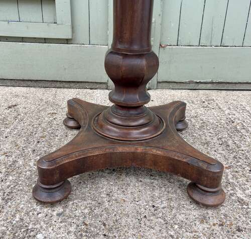 A 19th century centre table attributed to Holland and Sons