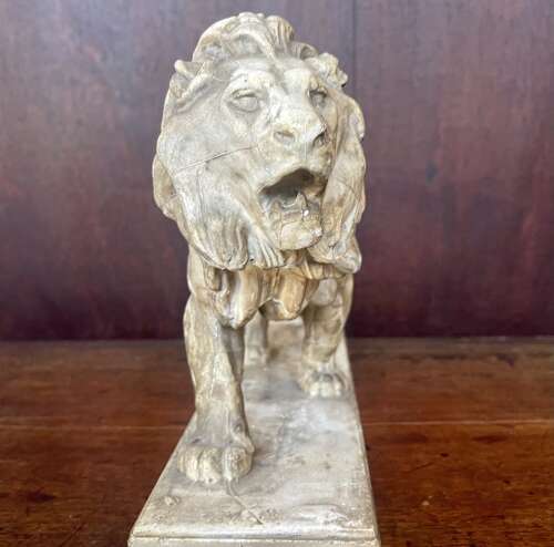 A 19th century plaster cast of the walking lion by Antoine-Louis Barye