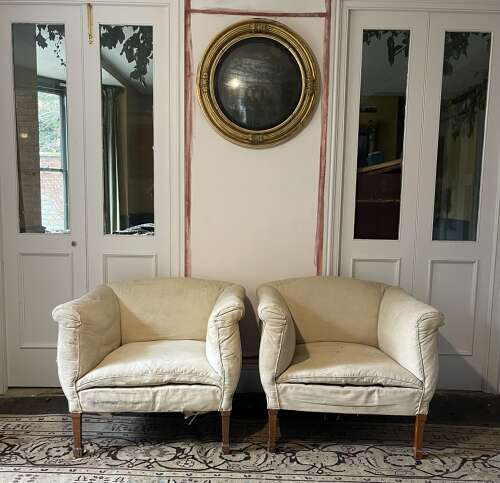 A pair of early 20th century English armchairs