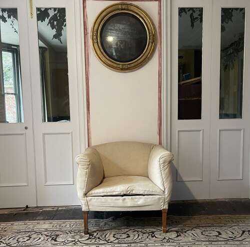 A pair of early 20th century English armchairs