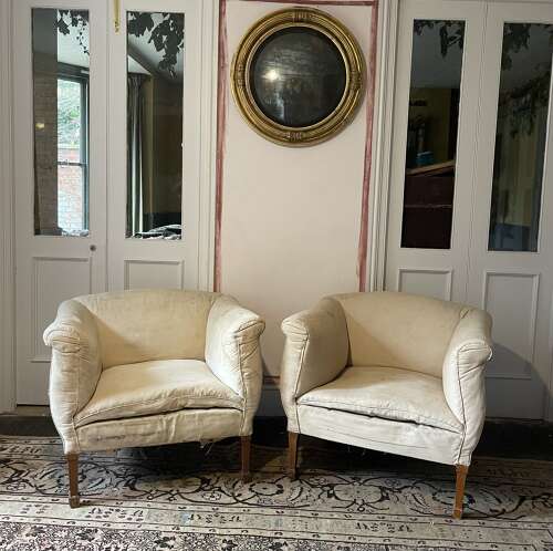 A pair of early 20th century English armchairs