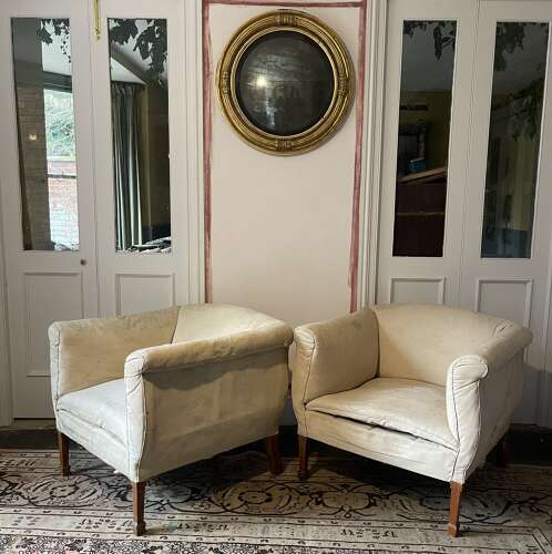A pair of early 20th century English armchairs
