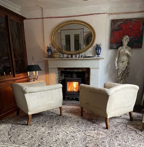 A pair of early 20th century English armchairs