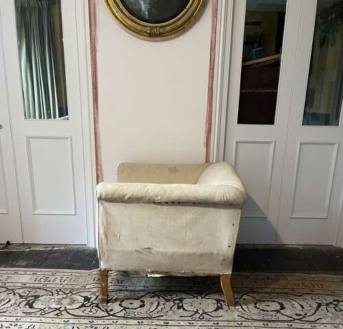 A pair of early 20th century English armchairs