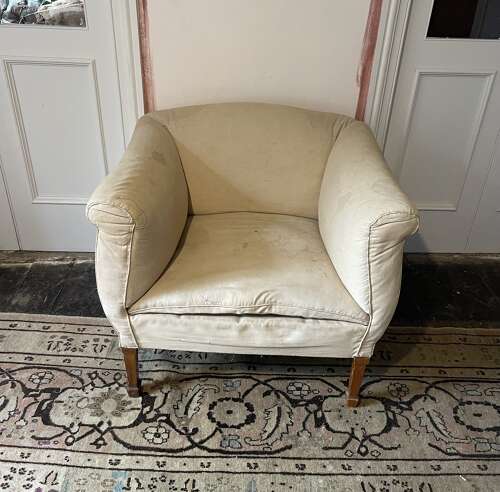 A pair of early 20th century English armchairs
