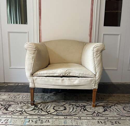 A pair of early 20th century English armchairs