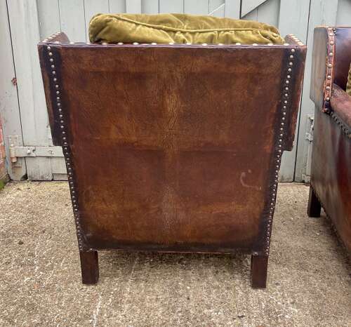 An Arts and Crafts studded leather 3 piece suite.