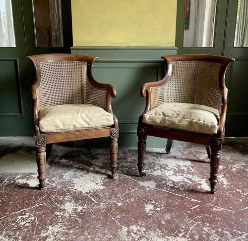 A pair of Regency bergere chairs