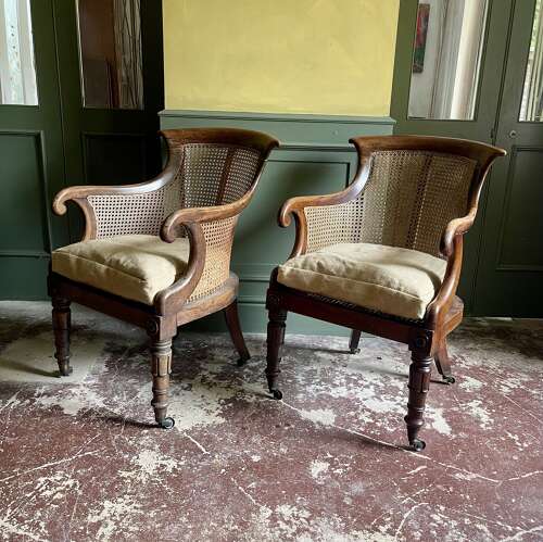 A pair of Regency bergere chairs