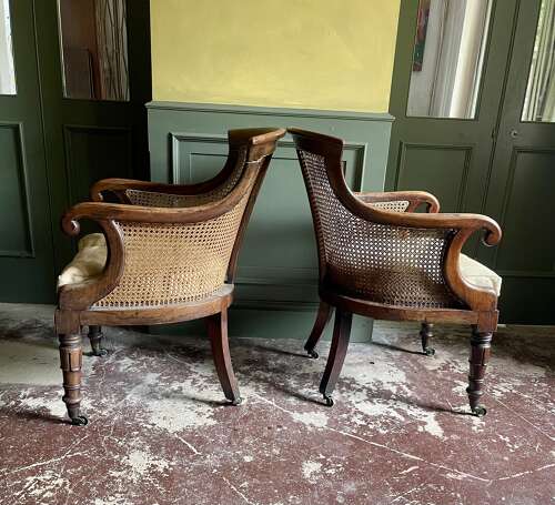 A pair of Regency bergere chairs