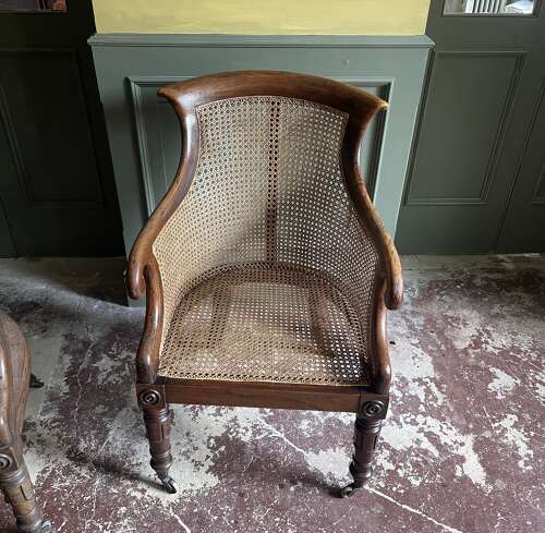 A pair of Regency bergere chairs