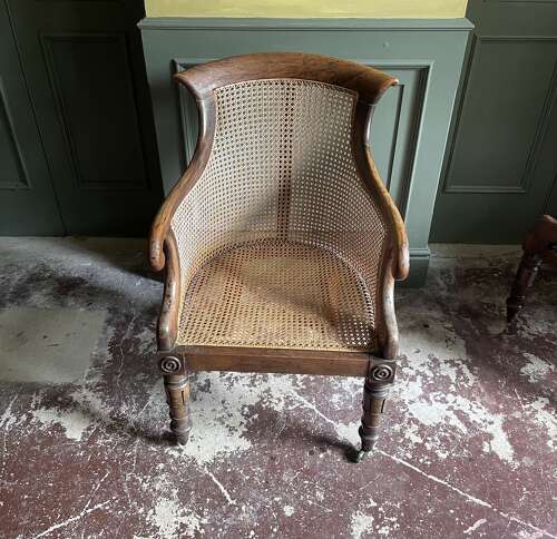 A pair of Regency bergere chairs