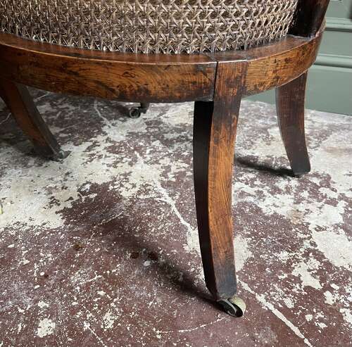 A pair of Regency bergere chairs