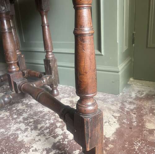 An 18th century yew wood gate leg table